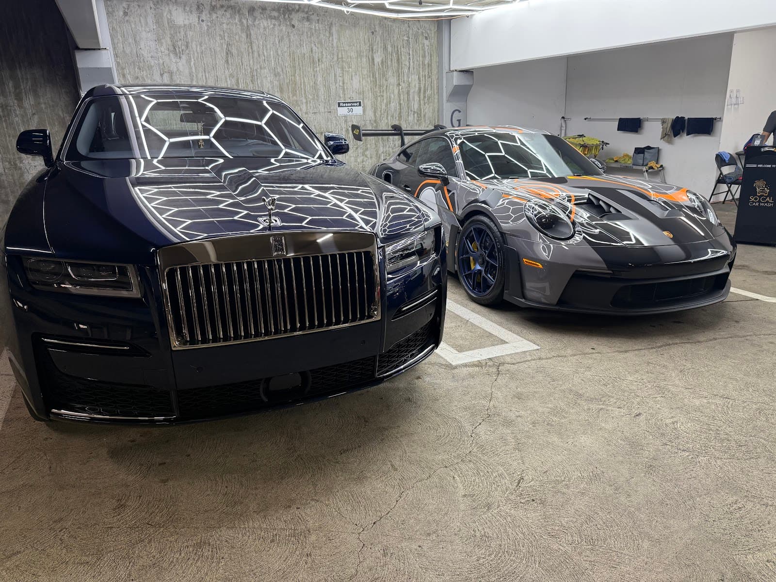 Detailed Rolls-Royce and Porsche inside SoCal Car Wash